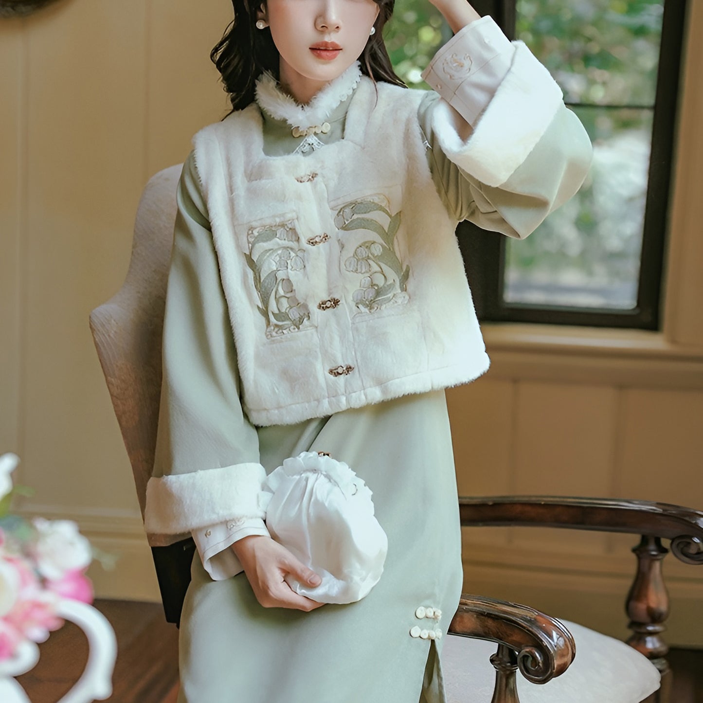 Woman wearing a Classic Republican-Style Qipao Winter Set, featuring retro elements and modern comfort.