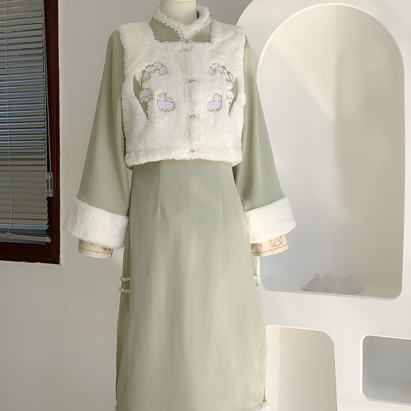 Woman wearing a Classic Republican-Style Qipao Winter Set, featuring retro elements and modern comfort.
