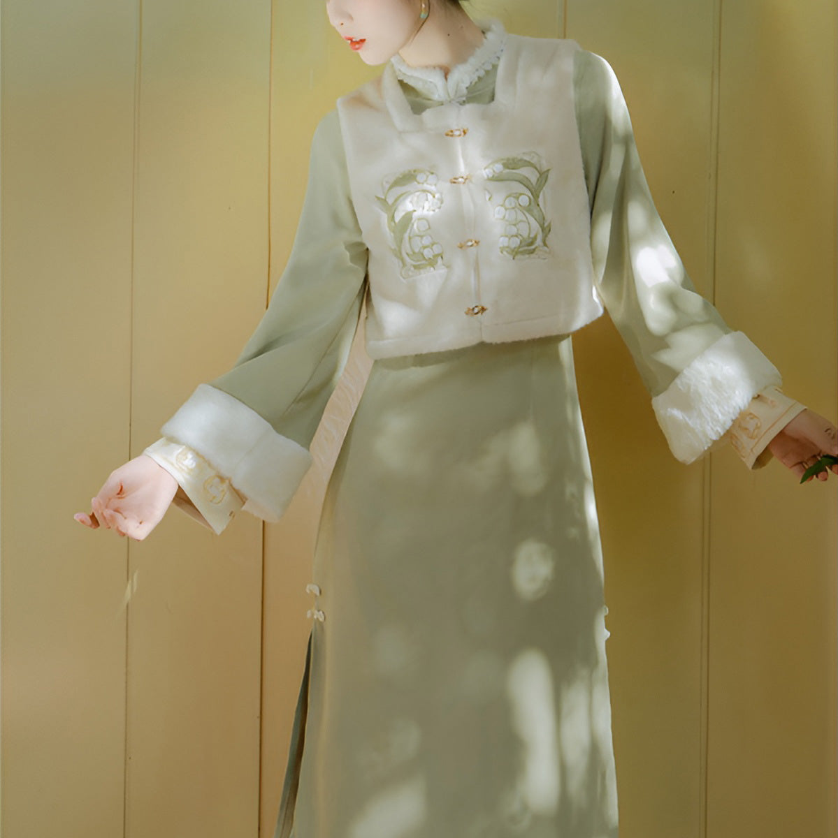 Woman wearing a Classic Republican-Style Qipao Winter Set, featuring retro elements and modern comfort.