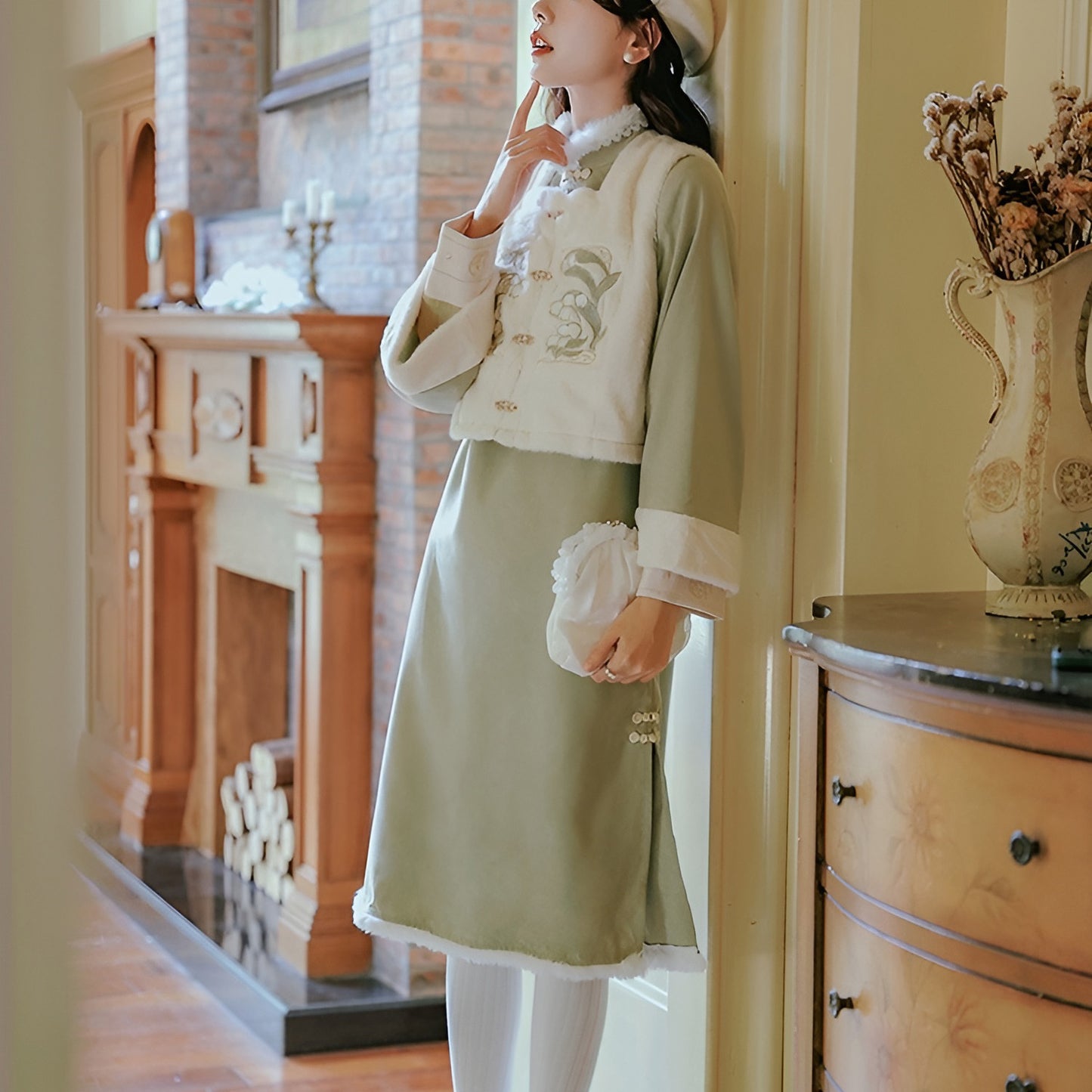 Woman wearing a Classic Republican-Style Qipao Winter Set, featuring retro elements and modern comfort.
