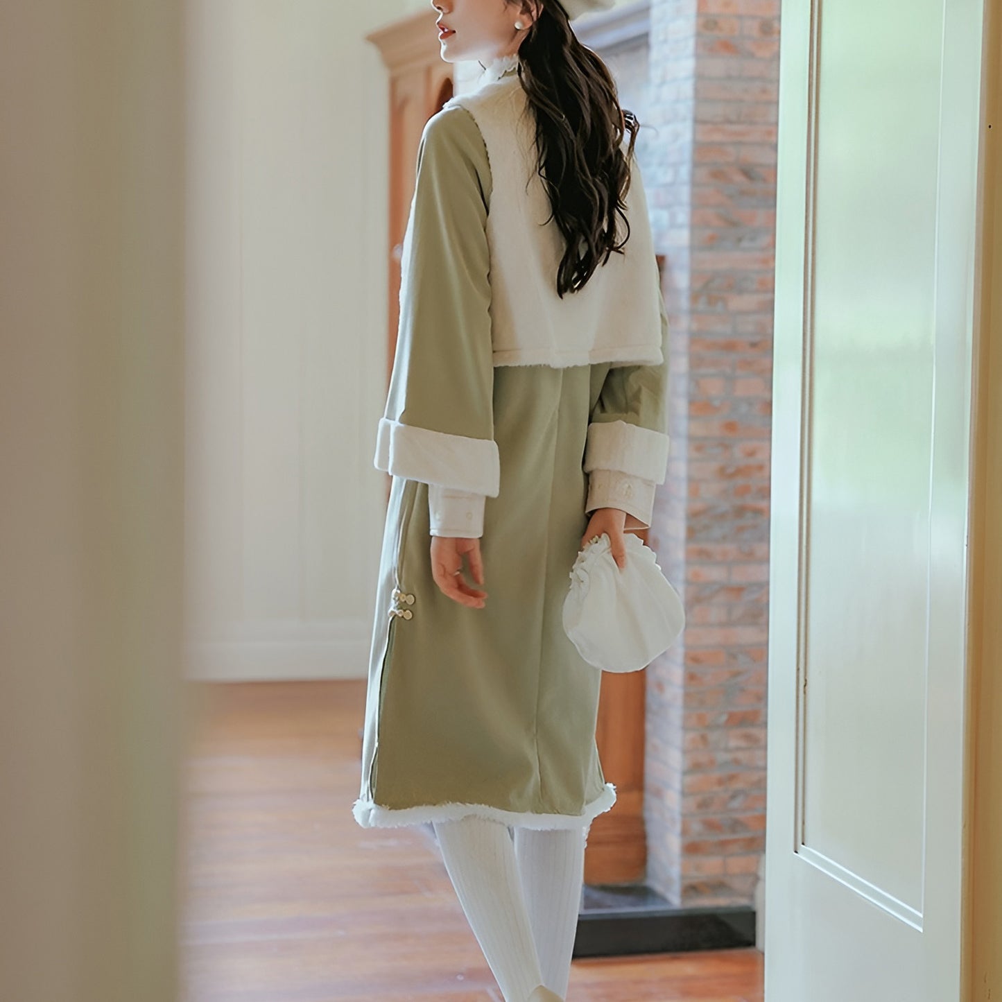 Woman wearing a Classic Republican-Style Qipao Winter Set, featuring retro elements and modern comfort.