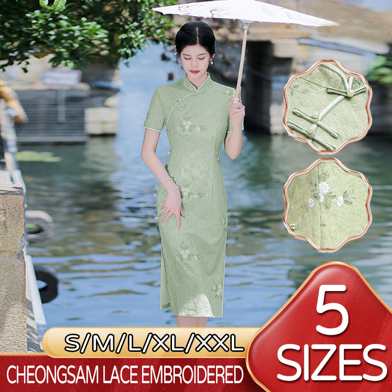 Woman wearing a pastel green modern Cheongsam dress with floral lace embroidery,