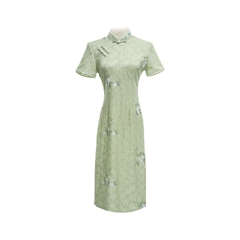 Woman wearing a pastel green modern Cheongsam dress with floral lace embroidery,