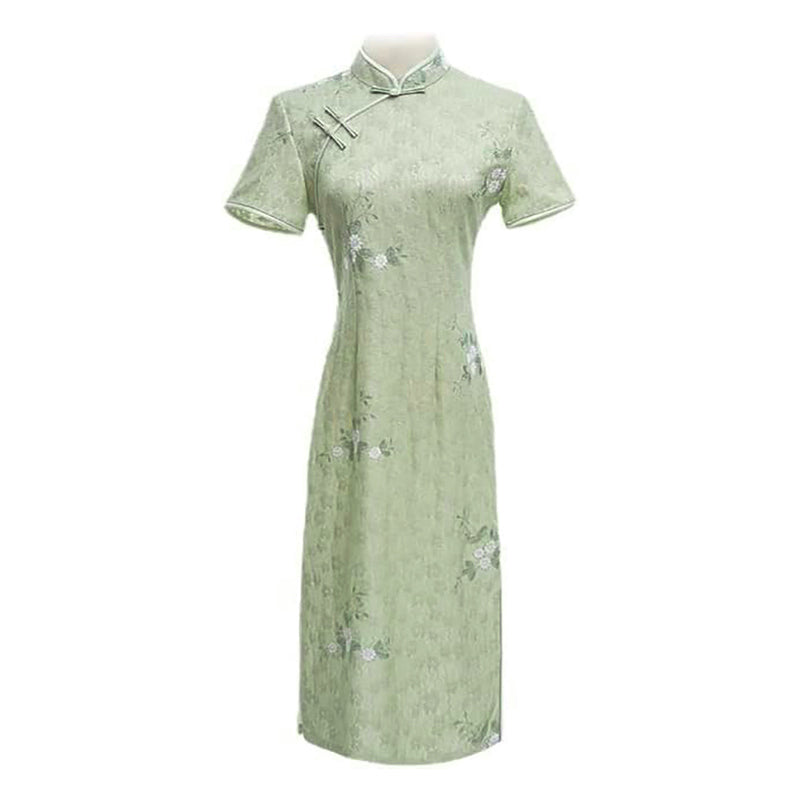 Woman wearing a pastel green modern Cheongsam dress with floral lace embroidery,