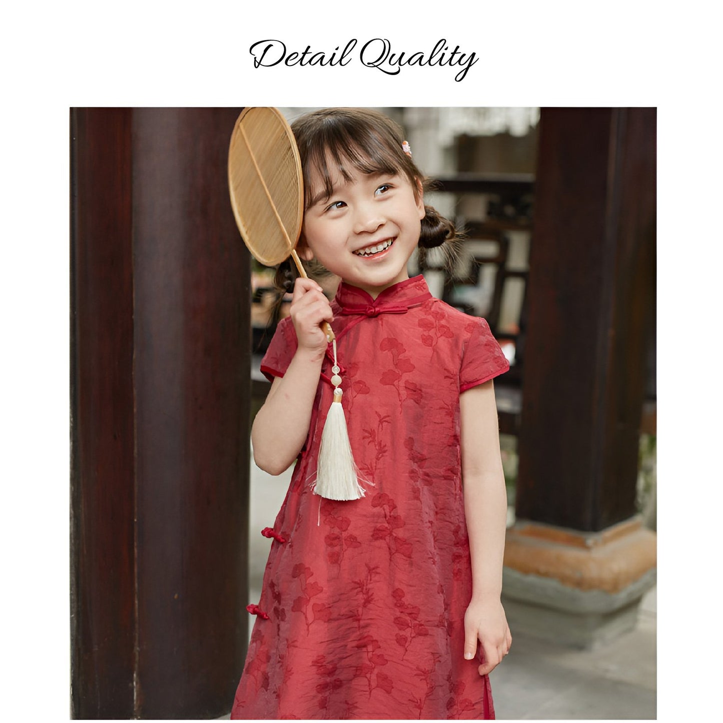 Girl wearing a red Chinese dress with floral print, available in 100-150cm.