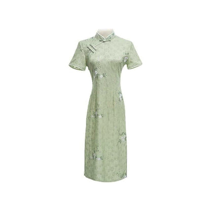 Woman wearing a pastel green modern Cheongsam dress with floral lace embroidery, 