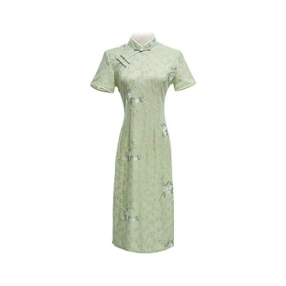 Woman wearing a pastel green modern Cheongsam dress with floral lace embroidery, 