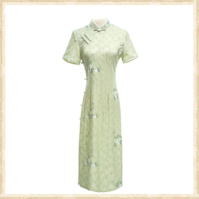 Woman wearing a pastel green modern Cheongsam dress with floral lace embroidery, 