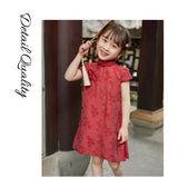 Girl wearing a red Chinese dress with floral print, available in 100-150cm.