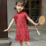 Girl wearing a red Chinese dress with floral print, available in 100-150cm.